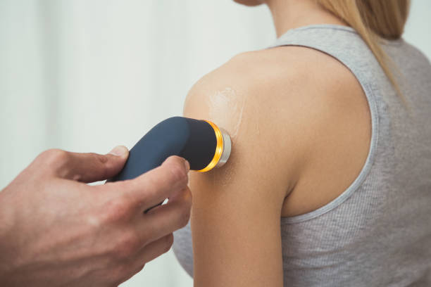 woman having a ultrasound therapy on her shoulder