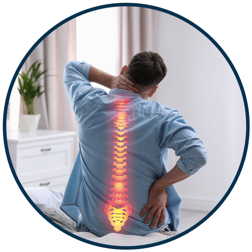 man sitting in couch suffer from back pain